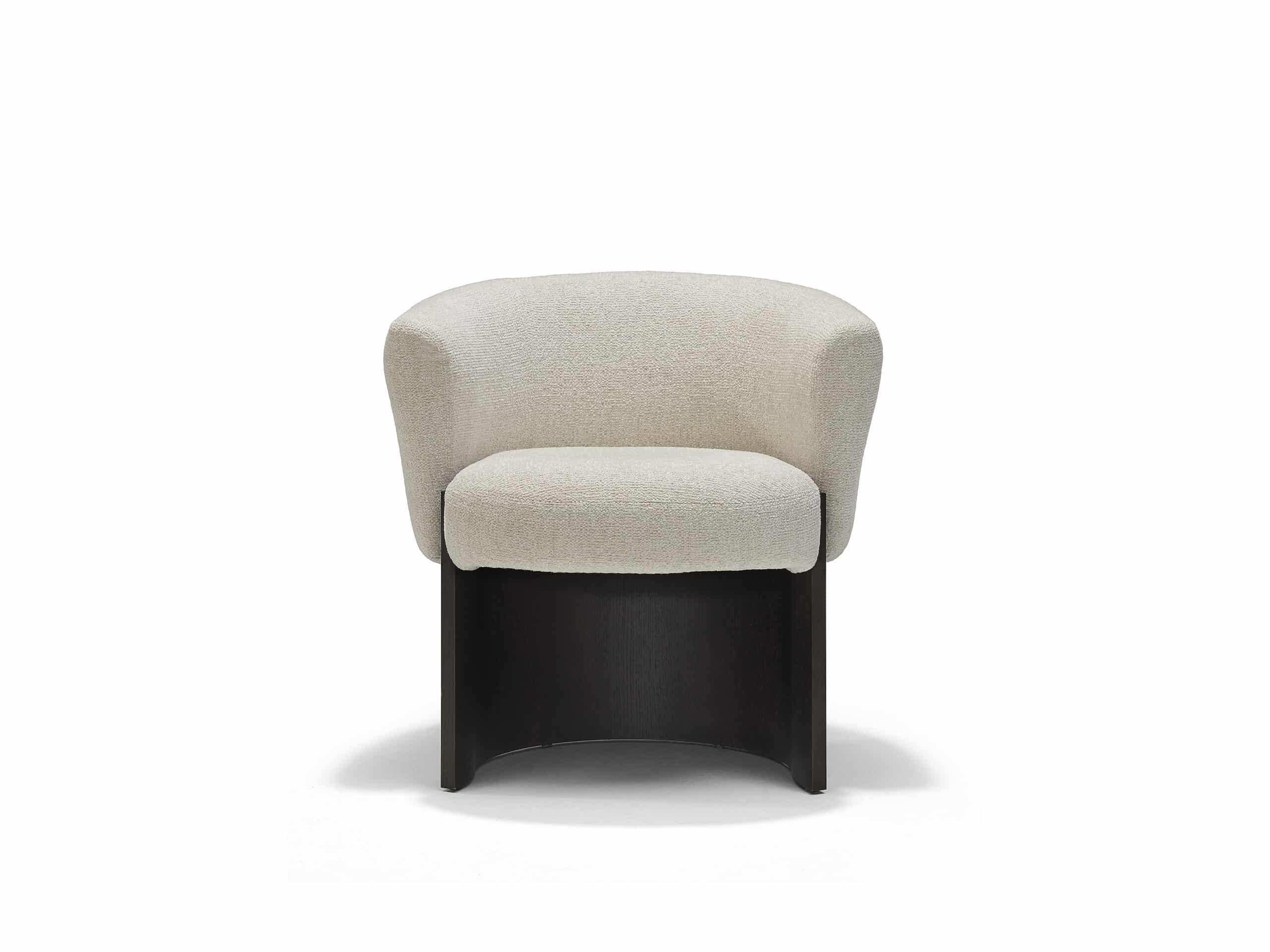 The Linteloo Claude dining chair, with a C-shaped oak veneer base and an upholstered seat and back.