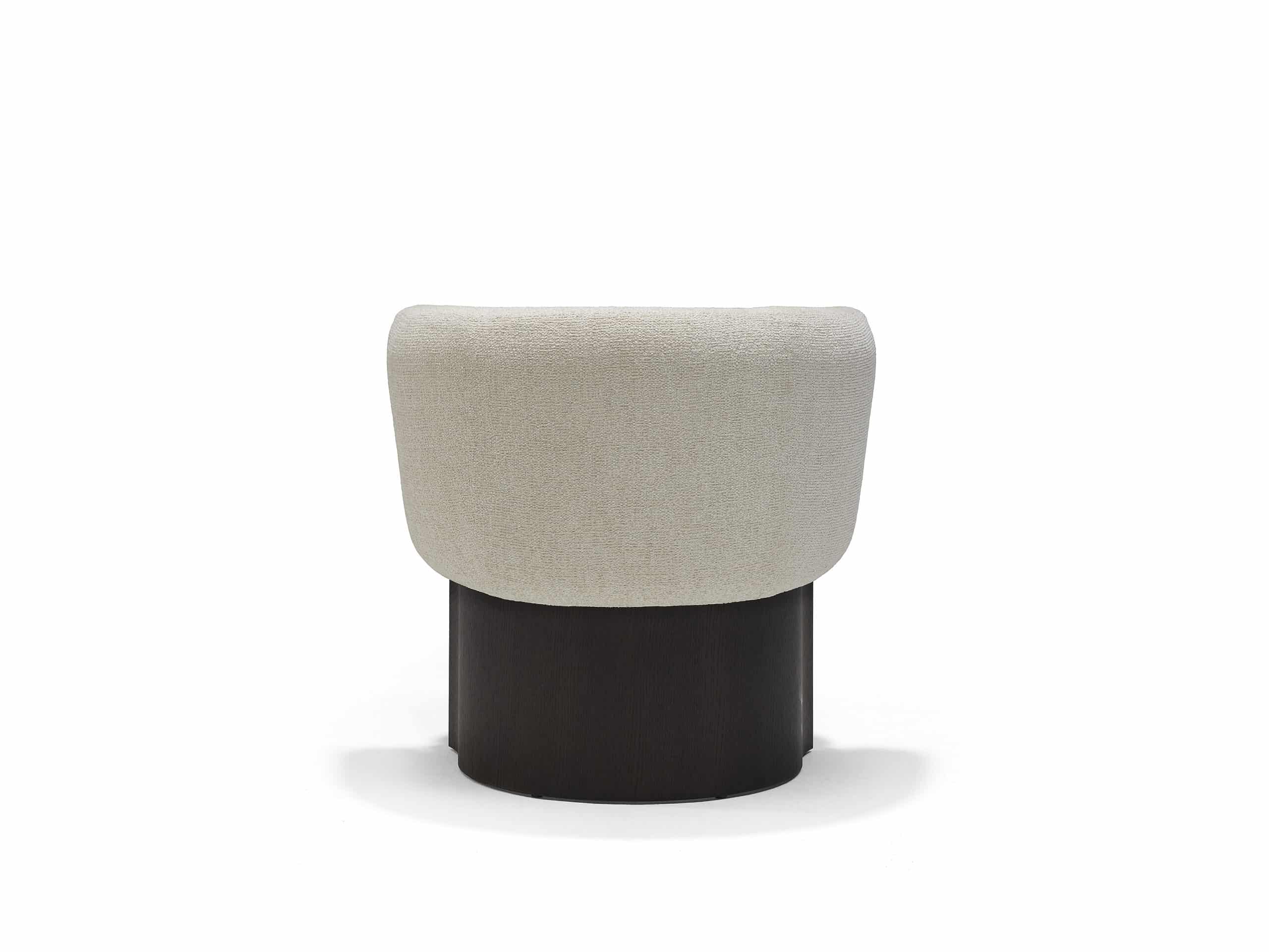 The Linteloo Claude dining chair, with a C-shaped oak veneer base and an upholstered seat and back.