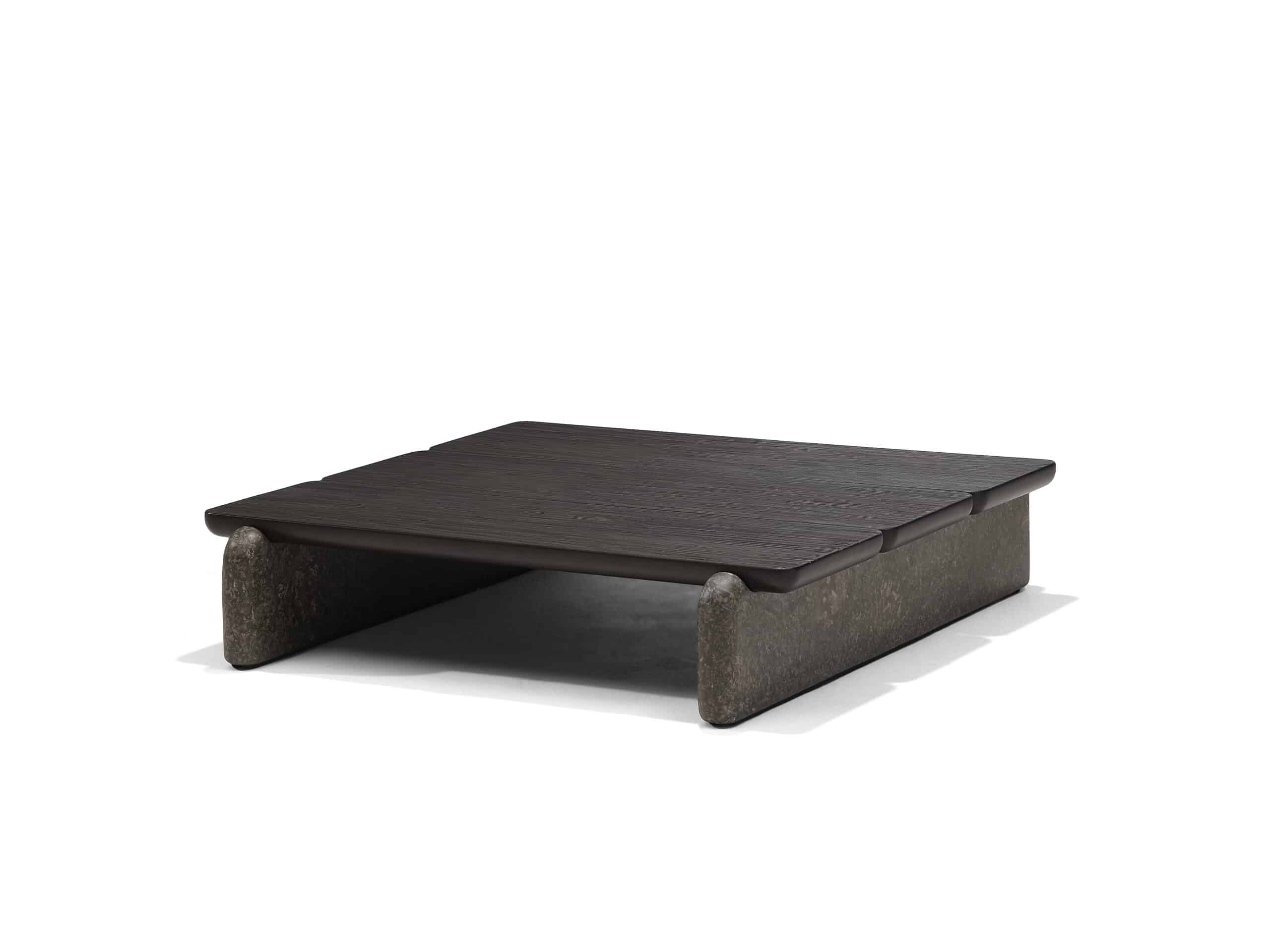 The Forma coffee table, consisting of two marble beams that support three intricately etched oak wood planks